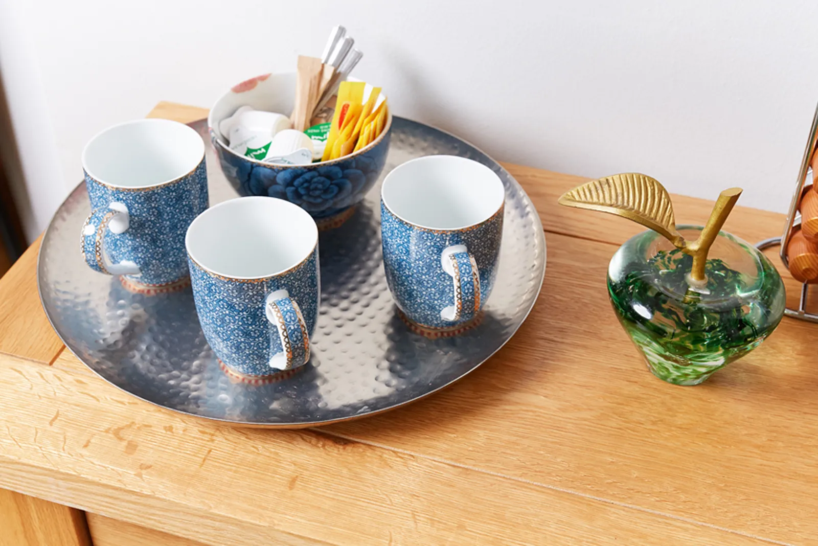 A tray of mugs and refreshments set out in the patient lounge