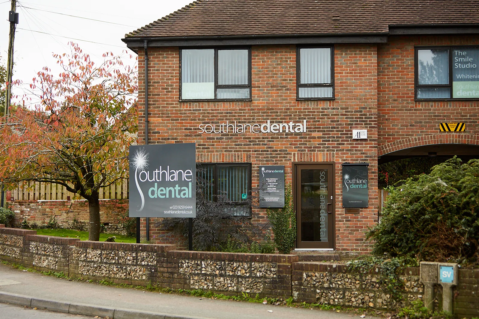 The South Lane Dental building at 3 South Lane, Clanfield, with its sign and front garden